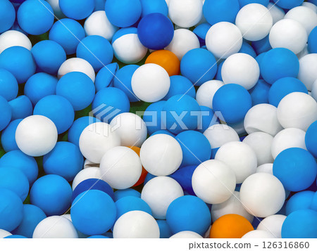 Colorful assortment of plastic balls in a play area creating a fun atmosphere for children during playtime 126316860