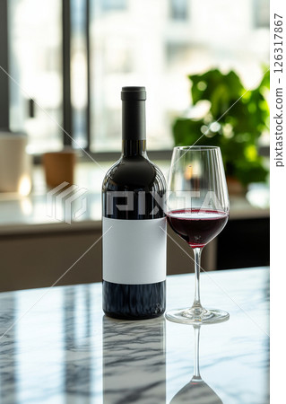 Red wine bottle with glass on marble table 126317867