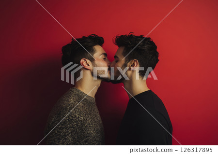 Romantic Kiss Between Two Men Against Red Background 126317895