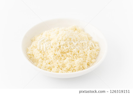 Grated cheese in a plate on a white background Grated cheese in a plate on a white background 126319151