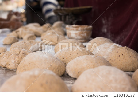 Bread preparation. loaves of dough before baking 126319158