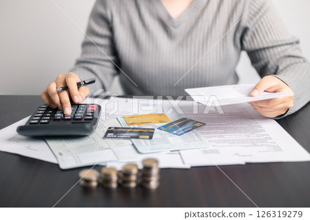 Finance bank tax expense accounting budget money businessman hand use calculator Financial calculate accountant close up calculator with graph chart write office desk Business expense analysis saving Finance bank tax expense accounting budget money businessman hand use calculator Financial calculate accountant close up calculator with graph chart write office desk Business expense analysis saving 126319279