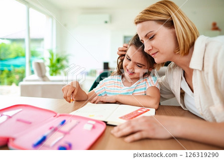Mother and daughter enjoying creative time together 126319290