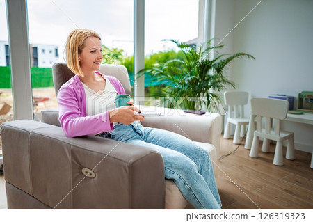 Relaxing afternoon with a warm drink in a cozy space 126319323