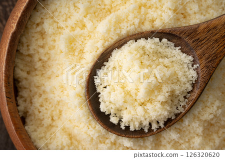 Close-up of grated cheese on a spoon 126320620