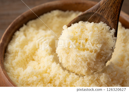 Close-up of grated cheese on a spoon 126320627