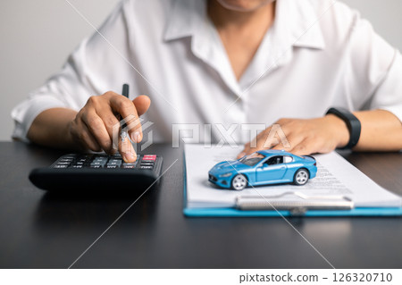 Finance bank tax expense accounting budget money businessman hand for Business expense analysis saving use car Financial calculate accountant close up calculator with graph chart write office desk 126320710