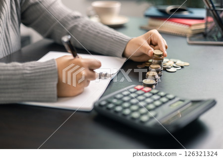 Finance bank tax expense accounting budget money businessman hand use calculator Financial calculate accountant close up calculator with graph chart write office desk Business expense analysis saving Finance bank tax expense accounting budget money businessman hand use calculator Financial calculate accountant close up calculator with graph chart write office desk Business expense analysis saving 126321324