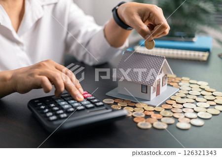 Finance bank tax expense accounting budget money businessman home for Business expense analysis saving use Financial calculate accountant close up calculator with graph chart hand write office desk 126321343