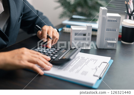 Finance bank tax expense accounting budget money businessman home for Business expense analysis saving use Financial calculate accountant close up calculator with graph chart hand write office desk Finance bank tax expense accounting budget money businessman home for Business expense analysis saving use Financial calculate accountant close up calculator with graph chart hand write office desk 126321440