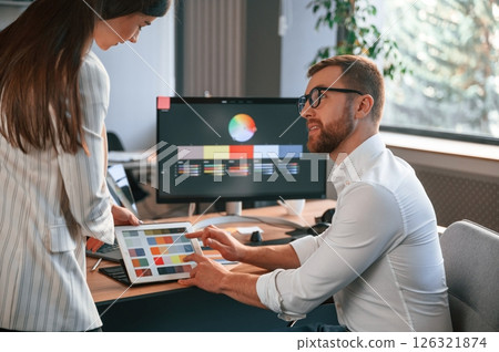 Creative job. Two designers are working together in the modern office 126321874