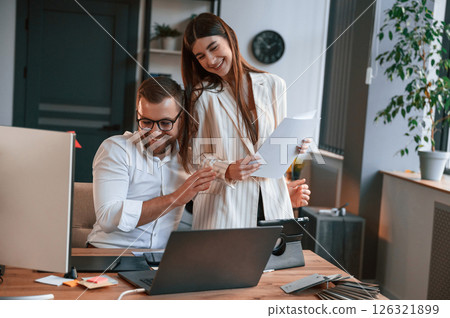 Two employees are working together in the modern office Two employees are working together in the modern office 126321899