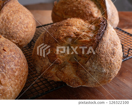 Freshly Baked Sourdough Loaf on Cafe table. 126322100