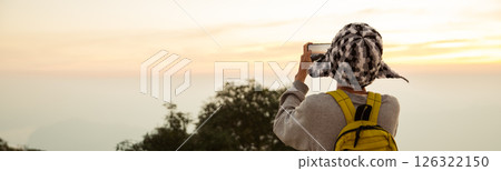Man traveler with backpack hiking outdoor travel lifestyle and adventure concept. join of tourist for green mountain tour beauty of nature and expansive sky people of tourism. banner with copy space Man traveler with backpack hiking outdoor travel lifestyle and adventure concept. join of tourist for green mountain tour beauty of nature and expansive sky people of tourism. banner with copy space 126322150