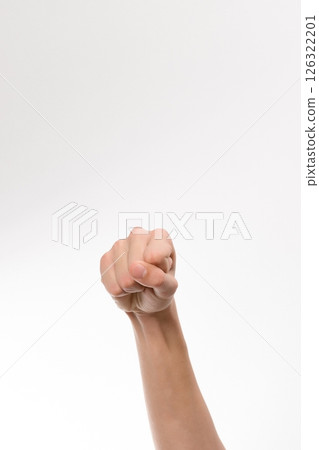 Close-up of a hand forming a fist against a white background. A simple, clean image ideal for various design projects. 126322201