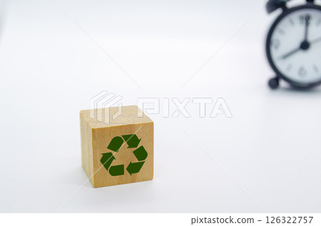 Recycle symbol with wooden blocks on a white background. Promoting reuse, reduce, and recycle for sustainability 126322757
