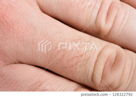 Close-up of human hand skin texture and hairs Close-up of human hand skin texture and hairs 126322792