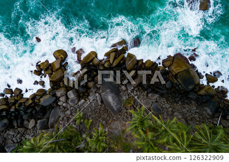 Aerial view Top down seashore, Waves crashing on rocks cliff, Beautiful sea surface in sunny day summer background, Amazing seascape top view seacoast at Phuket Thailand Aerial view Top down seashore, Waves crashing on rocks cliff, Beautiful sea surface in sunny day summer background, Amazing seascape top view seacoast at Phuket Thailand 126322909