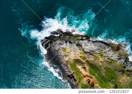 Aerial view Top down seashore, Waves crashing on rocks cliff, Beautiful sea surface in sunny day summer background, Amazing seascape top view seacoast at Phuket Thailand 126322927