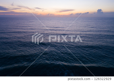 Aerial view sunset sky,Nature beautiful light sunset or sunrise over sea,Colorful dramatic majestic scenery sunset Sky with Amazing clouds and waves texture colorful sky cloud background Aerial view sunset sky,Nature beautiful light sunset or sunrise over sea,Colorful dramatic majestic scenery sunset Sky with Amazing clouds and waves texture colorful sky cloud background 126322929