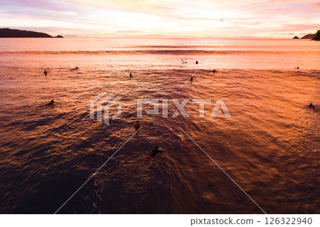 Aerial view sunset sky,Nature beautiful light sunset or sunrise over sea,Colorful dramatic majestic scenery sunset Sky with Amazing clouds and waves texture colorful sky cloud background 126322940