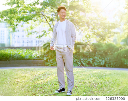 A man in his 30s relaxing in the park Male portrait 126323000