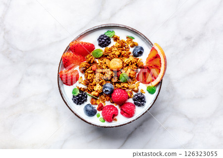 Granola with yogurt and fresh fruit. Organic gourmet muesli with ingredients 126323055
