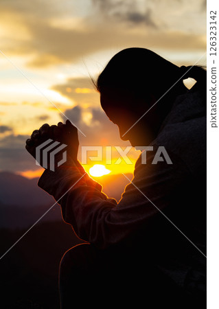 Close up christians hands pray to God with spiritual faith on holy bible in catholic church religion worship prayer ask god bless pray grace jesus believe Christianity religion prayer holy worship. Close up christians hands pray to God with spiritual faith on holy bible in catholic church religion worship prayer ask god bless pray grace jesus believe Christianity religion prayer holy worship. 126323142