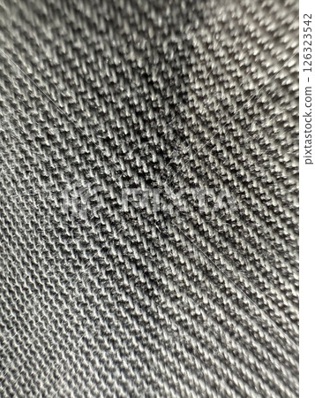 Close up of a black and white fabric with a lot of texture Close up of a black and white fabric with a lot of texture 126323542