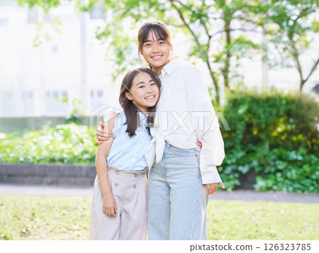 Portrait of smiling sisters Portrait of smiling sisters 126323785