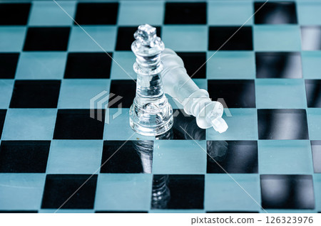 transparent glass chess on dark background, selective focus on king piece, close up transparent glass chess on dark background, selective focus on king piece, close up 126323976