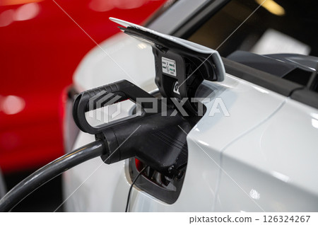 EV car connected to the charger, eco friendly technology 126324267