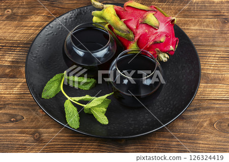 A glass of dragon fruit juice. A glass of dragon fruit juice. 126324419