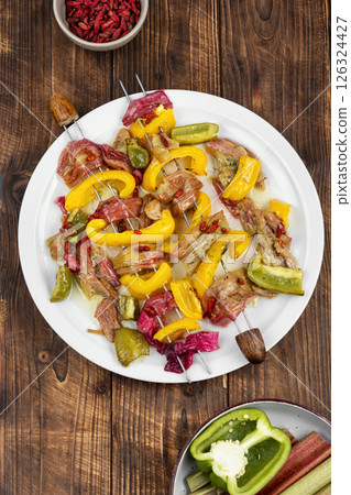 Baked rhubarb on skewers. 126324427