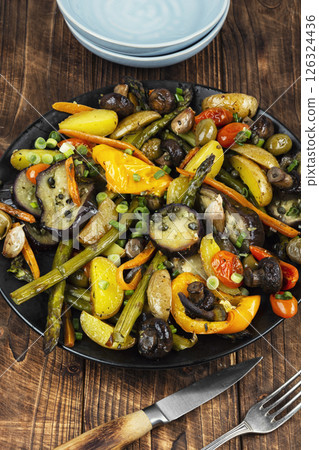 Roasted hot vegetables on a plate. 126324436