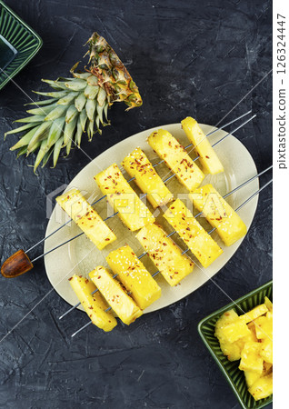 Fresh pineapple fruit skewers. 126324447
