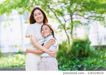 Smiling mother and daughter portrait 126324619