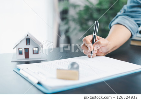 Businesswoman hand stamp approve on financial business approval document paper. Man hand accept permit contract agreement. Broker manager sign contract bank guarantee approved stamp application form Businesswoman hand stamp approve on financial business approval document paper. Man hand accept permit contract agreement. Broker manager sign contract bank guarantee approved stamp application form 126324932
