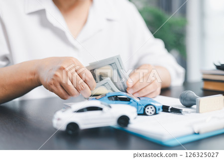 Businesswoman hand stamp approve on financial business approval document paper. Man hand accept permit contract agreement. Broker manager sign contract bank guarantee approved stamp application form Businesswoman hand stamp approve on financial business approval document paper. Man hand accept permit contract agreement. Broker manager sign contract bank guarantee approved stamp application form 126325027