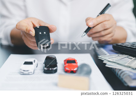 Businesswoman hand stamp approve on financial business approval document paper. Man hand accept permit contract agreement. Broker manager sign contract bank guarantee approved stamp application form 126325031