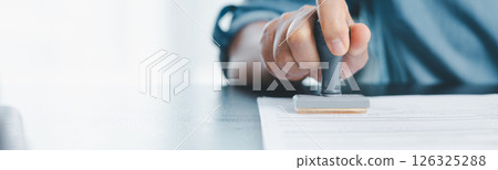 Banner of businessman hands stamp approve on financial business approval document paper. hand accepted permit contract agreement. Broker manager sign contract bank guarantee approved application form 126325288