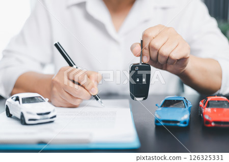 Businesswoman hand stamp approve on financial business approval document paper. Man hand accept permit contract agreement. Broker manager sign contract bank guarantee approved stamp application form Businesswoman hand stamp approve on financial business approval document paper. Man hand accept permit contract agreement. Broker manager sign contract bank guarantee approved stamp application form 126325331