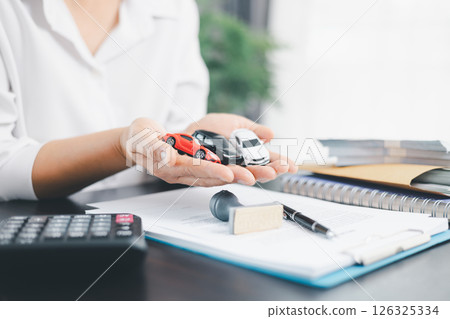 Businesswoman hand stamp approve on financial business approval document paper. Man hand accept permit contract agreement. Broker manager sign contract bank guarantee approved stamp application form 126325334