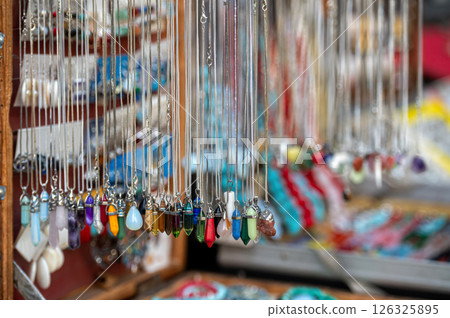 Colorful Handmade Jewelry Displayed at Artisan Market Stall During Sunny Afternoon 126325895