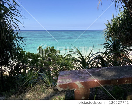 A rest bench overlooking the blue ocean of Okinawa A rest bench overlooking the blue ocean of Okinawa 126327741