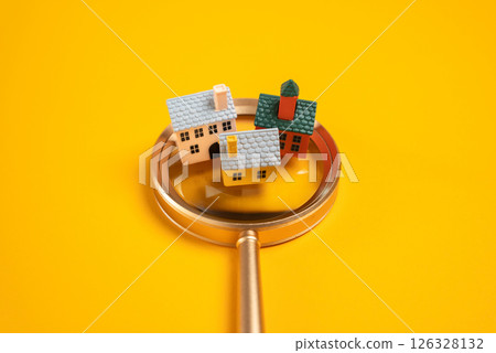 Houses on a magnifying glass. Search for housing for rent or purchase. Realtor service. Guide to the city and the real estate market. Tourism. Real estate online platforms. Property searches 126328132