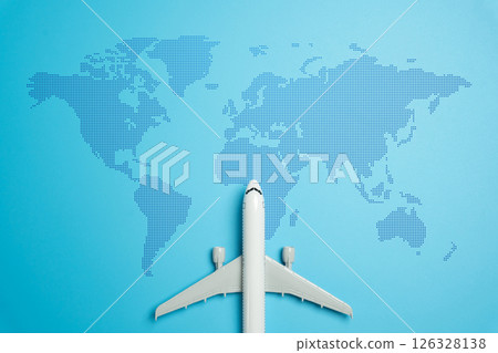 Passenger plane and world map. Passenger transportation and international flights. Tourism and travel. International mobility, tourism growth, and the logistics of global passenger transport. Passenger plane and world map. Passenger transportation and international flights. Tourism and travel. International mobility, tourism growth, and the logistics of global passenger transport. 126328138