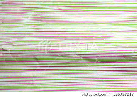 colorful striped crumpled wrapping paper for gifts. bright texture of horizontal stripes closeup 126328218