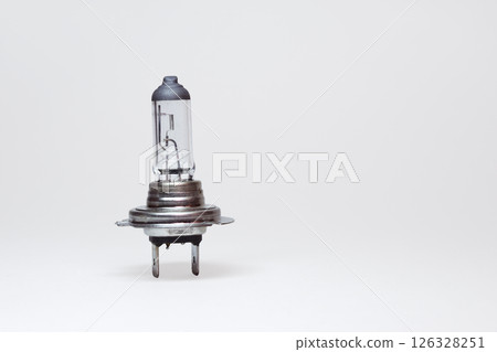 halogen low beam lamp for car headlights. spare parts. include clipping path for easy isolation from background halogen low beam lamp for car headlights. spare parts. include clipping path for easy isolation from background 126328251