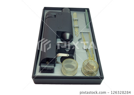monocular microscope in portable case for storing with tools and asseseories. isolated on white background monocular microscope in portable case for storing with tools and asseseories. isolated on white background 126328284